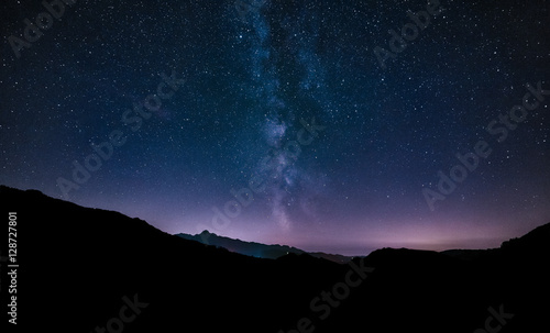 purple night sky stars. Milky way galaxy across mountains. Starr