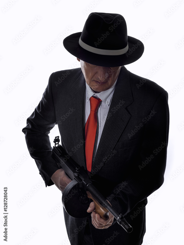 Old style gangster with tommy gun, on white background Old style gangster with tommy gun, on white background