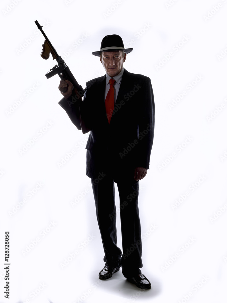 Old style gangster with tommy gun, on white background Old style gangster with tommy gun, on white background
