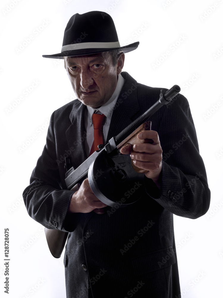 Old style gangster with tommy gun, on white background Old style gangster with tommy gun, on white background
