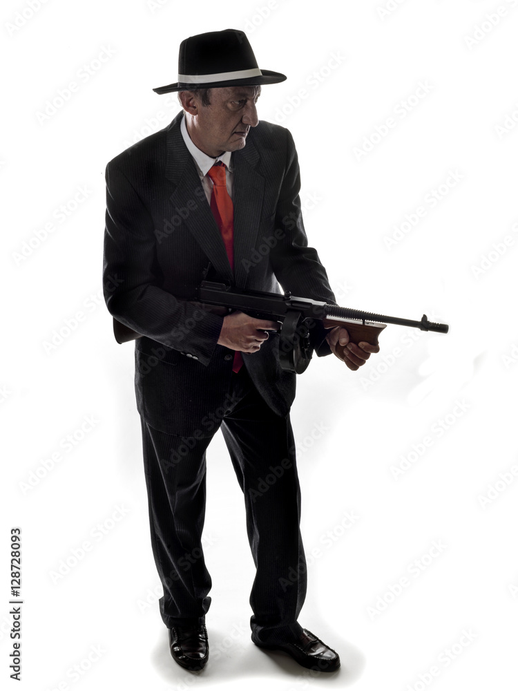 Old style gangster with tommy gun, on white background Old style gangster with tommy gun, on white background