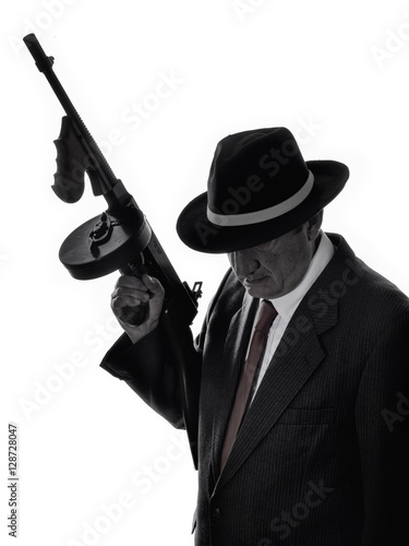 Old style gangster with tommy gun, on white background photo