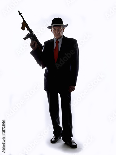 Old style gangster with tommy gun, on white background