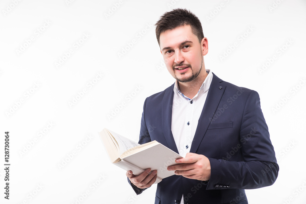 Happy smiling guy in suit holding book and looking at camera over white background