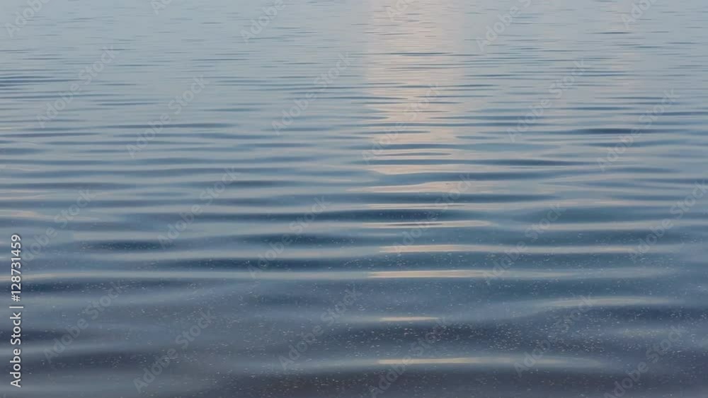 Small vaves on the river. Beautiful tranquil background with ripple. Small vaves on the river. Beautiful tranquil background with ripple.