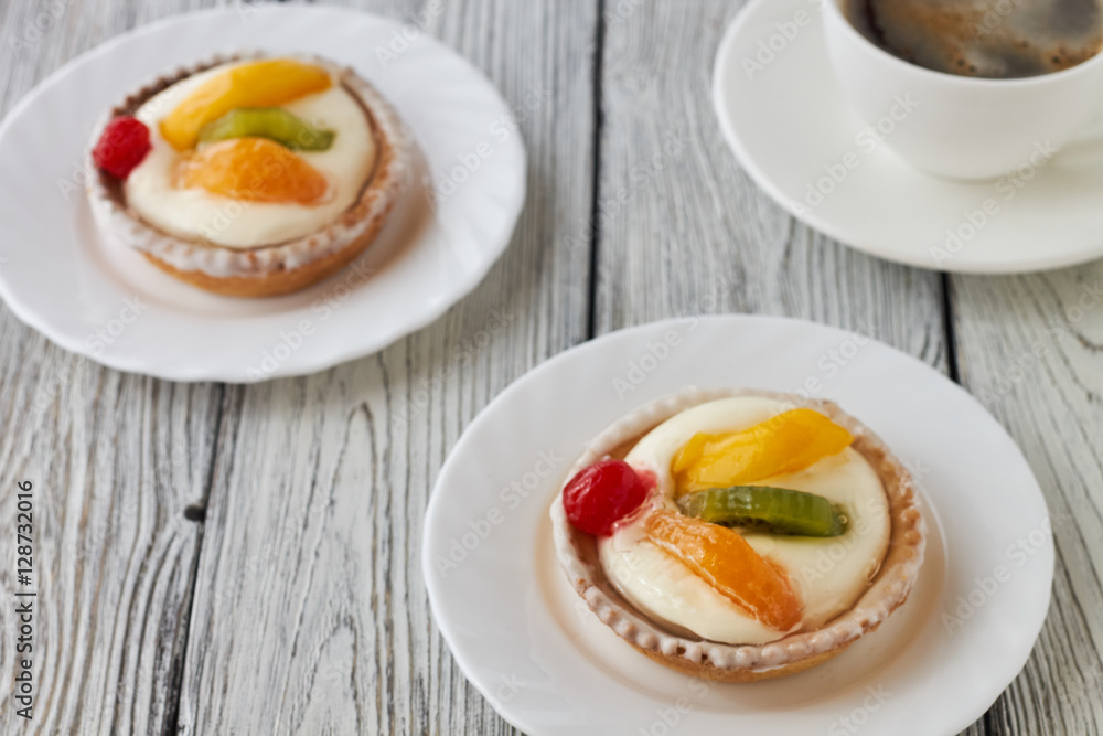 Tartlets with cream and fruits, orange, kiwi, cherry Tartlets with cream and fruits, orange, kiwi, cherry