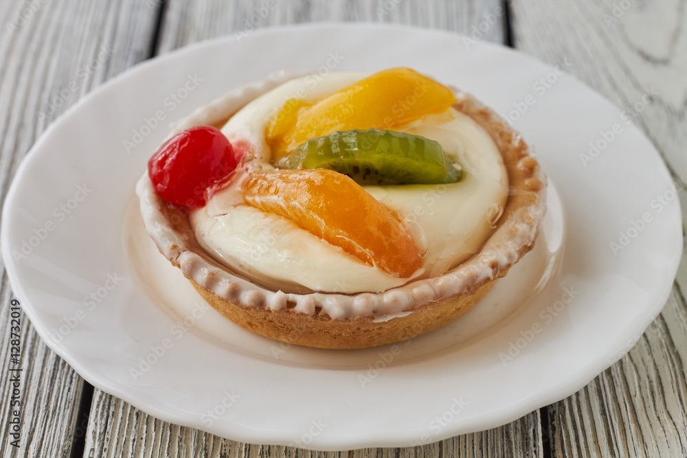 Tartlets with cream and fruits, orange, kiwi, cherry Tartlets with cream and fruits, orange, kiwi, cherry