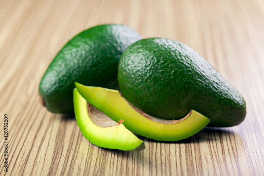 avocado on a wooden background avocado on a wooden background
