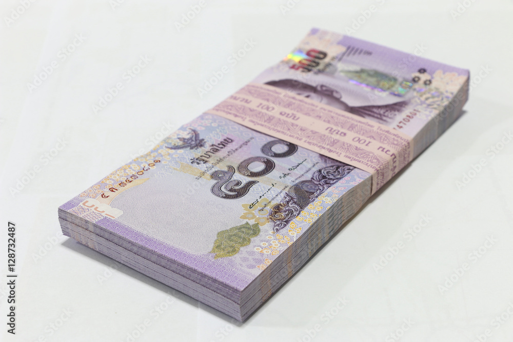 Thai currency on White background ,Stack of thai baht Thai currency on White background ,Stack of thai baht