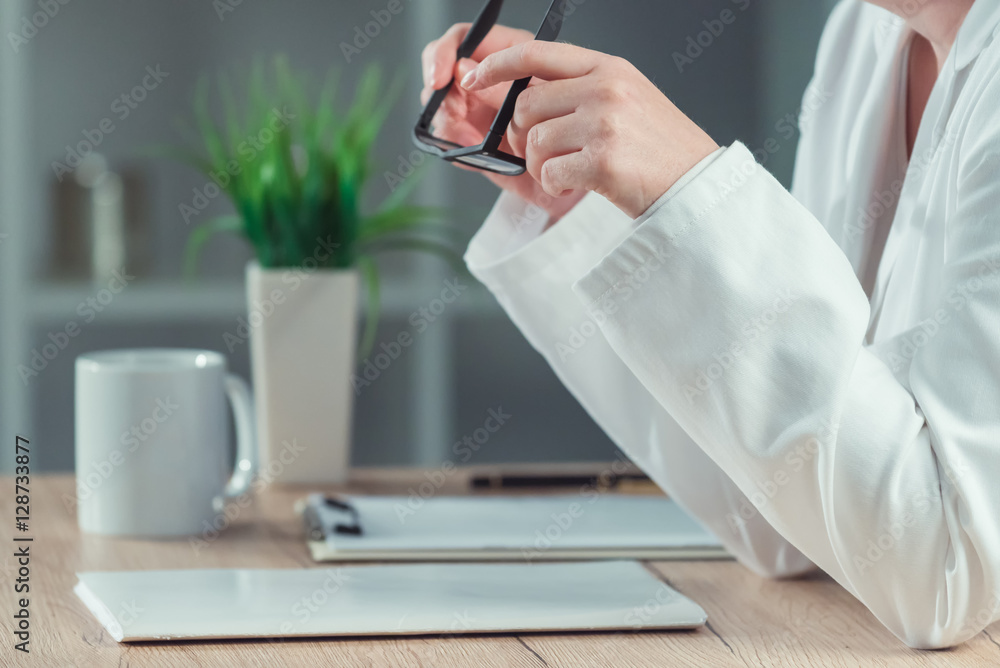 Female doctor reading patient medical history record