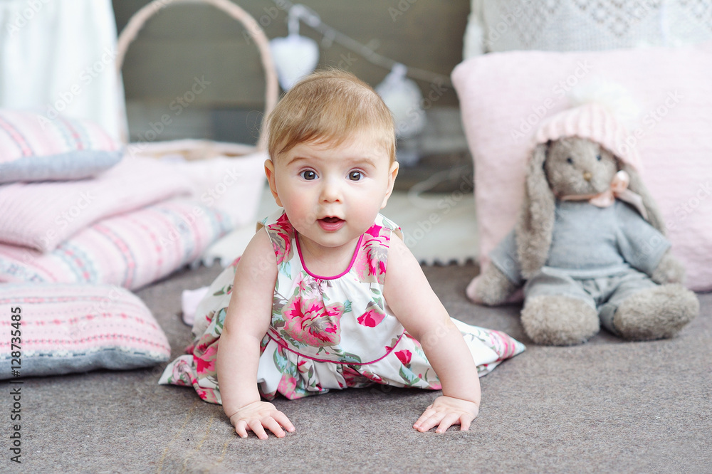 Adorable smiling baby girl crawling Adorable smiling baby girl crawling