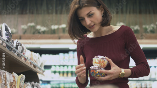 Family makes purchases in the supermarket