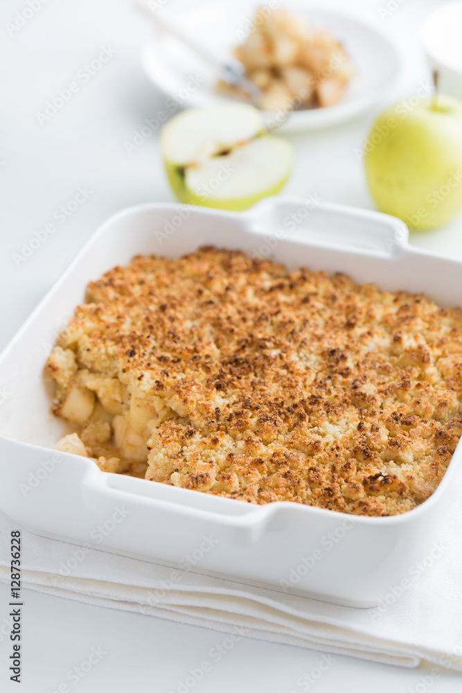 apple crumble pie in white baking dish apple crumble pie in white baking dish