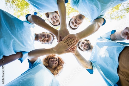 Group of volunteer forming huddles photo