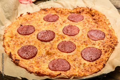 Appetizing background pepperoni pizza closeup filling the frame