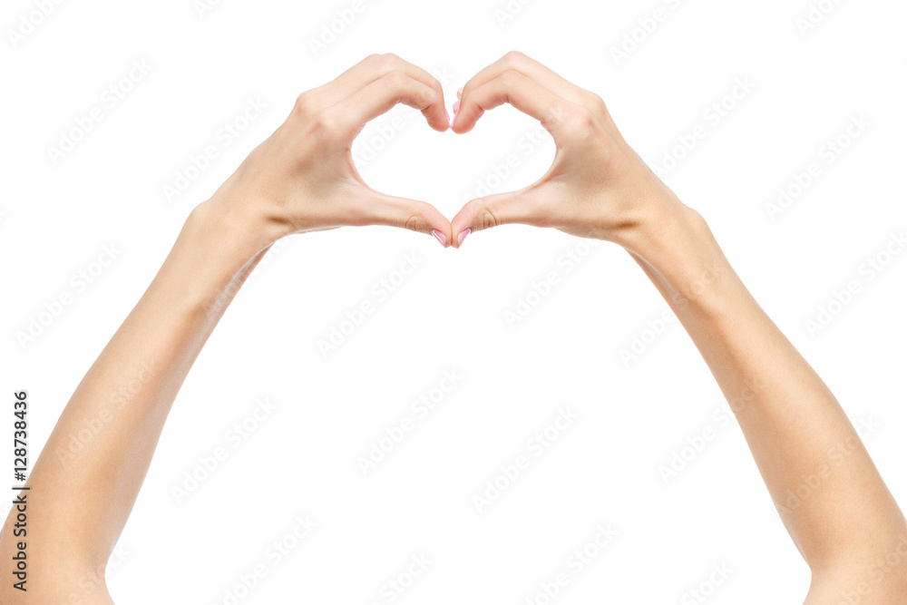 Beautiful woman showing heart sign by hands