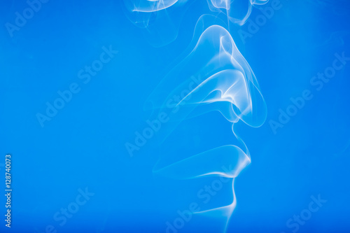 White smoke shape on a blue backgrounds