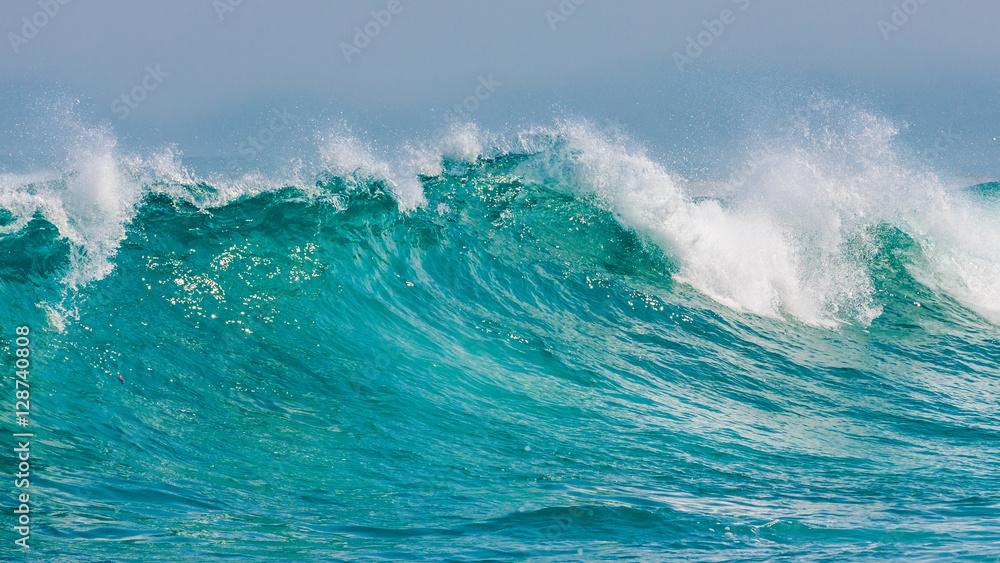 Stunning massive rolling waves crashing into the rocks near Margaret beach, Western Australia