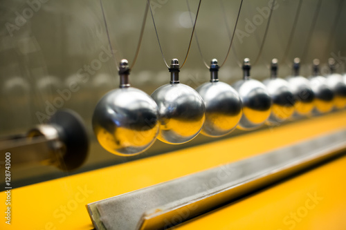 Row of metallic balls for inertia experiments photo
