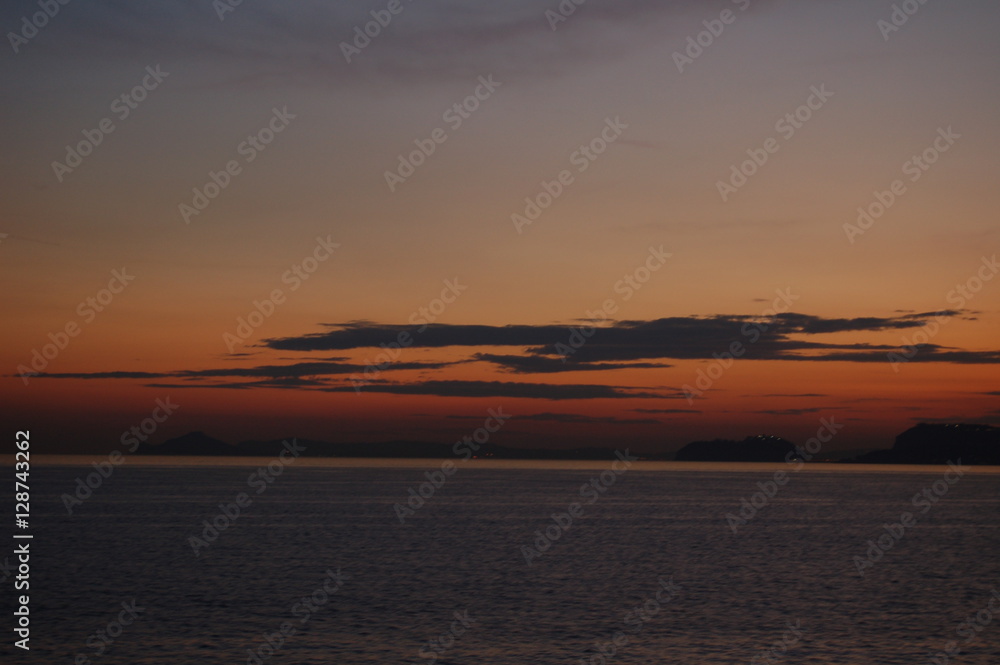 Amazing sunset over the sea in summer, Eolie Islands, Italy Amazing sunset over the sea in summer, Eolie Islands, Italy