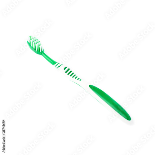 Green toothbrush isolated over white background