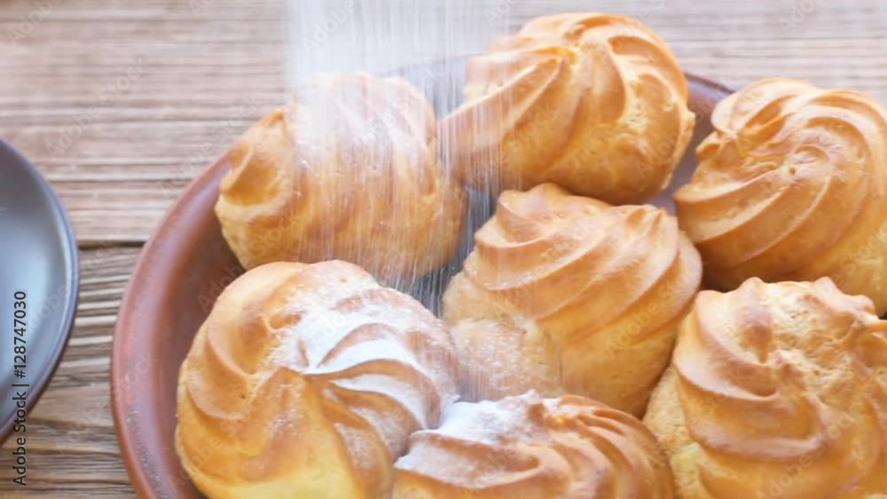 Delicious profiteroles with cream dessert. Delicious profiteroles with cream dessert.