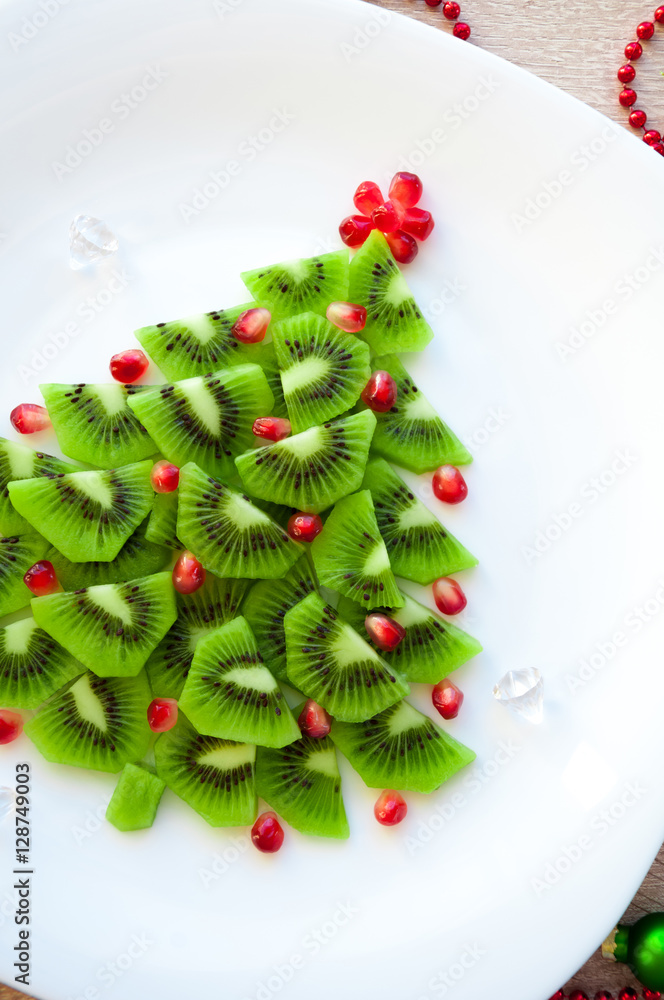 Fruit Kiwi Christmas tree - New Year food background top view blank space for text