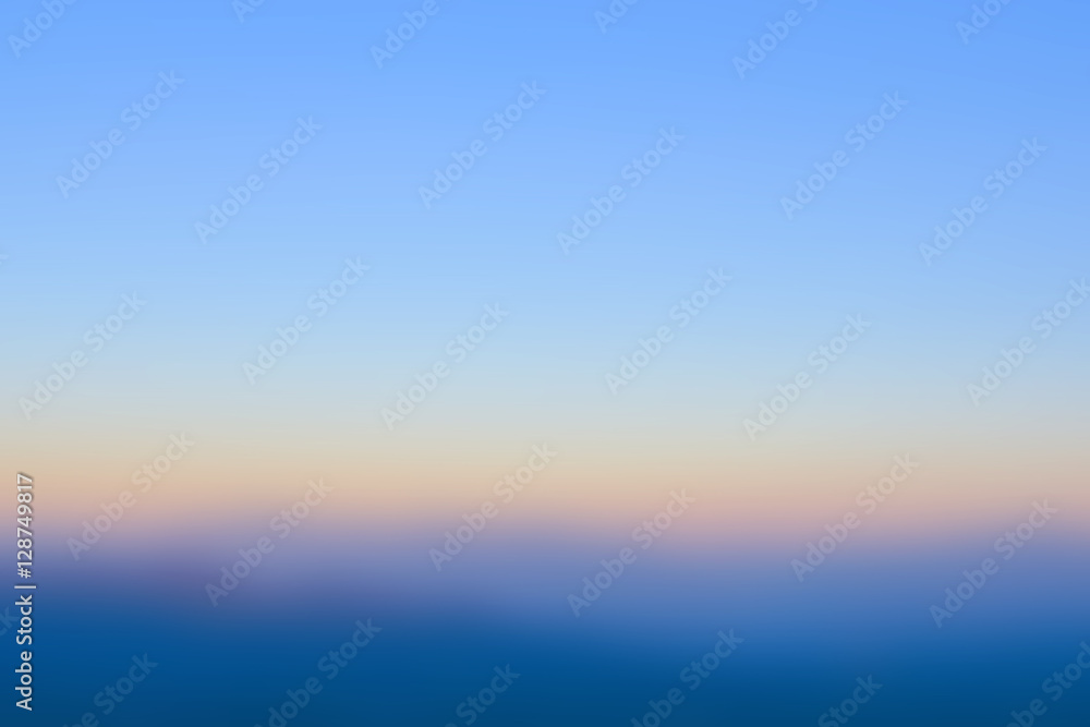 Obraz premium abstract bright blurred sunrise sky for vacation or travel background
