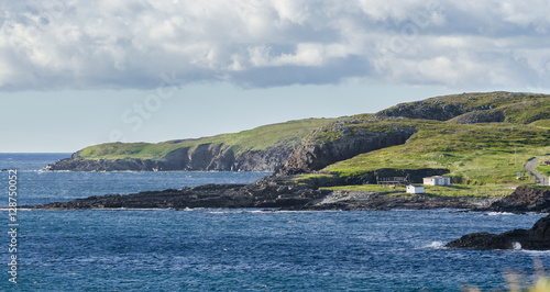 Ellistion cliffs, hillsides and shoreline.   Rocky coastline in Elliston village along the coast fingers of the Island of Newfoundland, Canada.