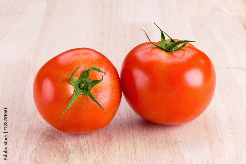 tomatoes on wooden background. tomatoes on wooden background.
