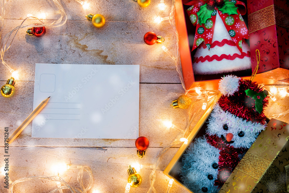 Fototapeta premium Merry Christmas .snowing and happy new year event on wood . Open Warm white light. Filter effect