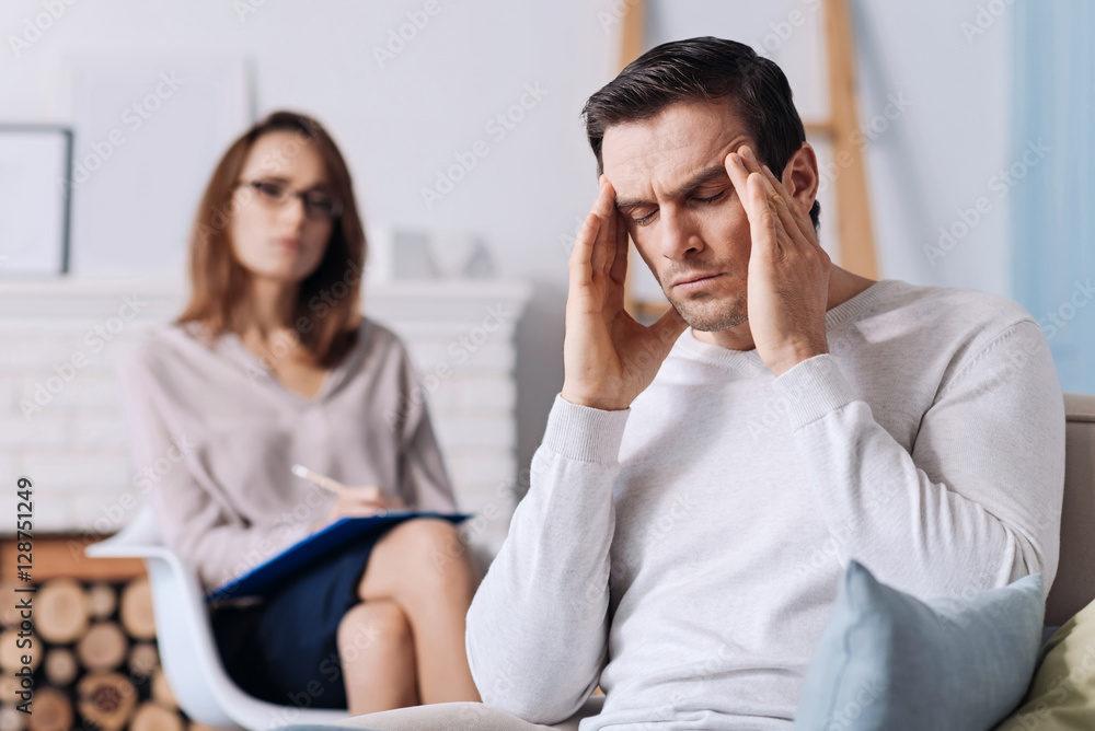 Tired man having consultation with psychologist Tired man having consultation with psychologist