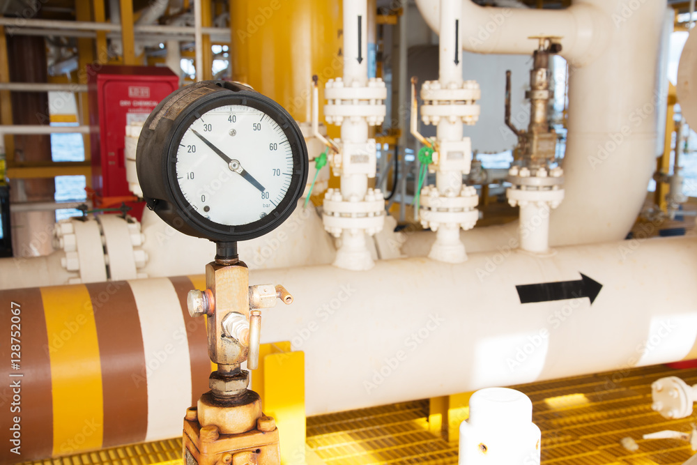pressure gauge,pressure gauge measuring gas pressure. Pipes and valves at oil and gas industrial