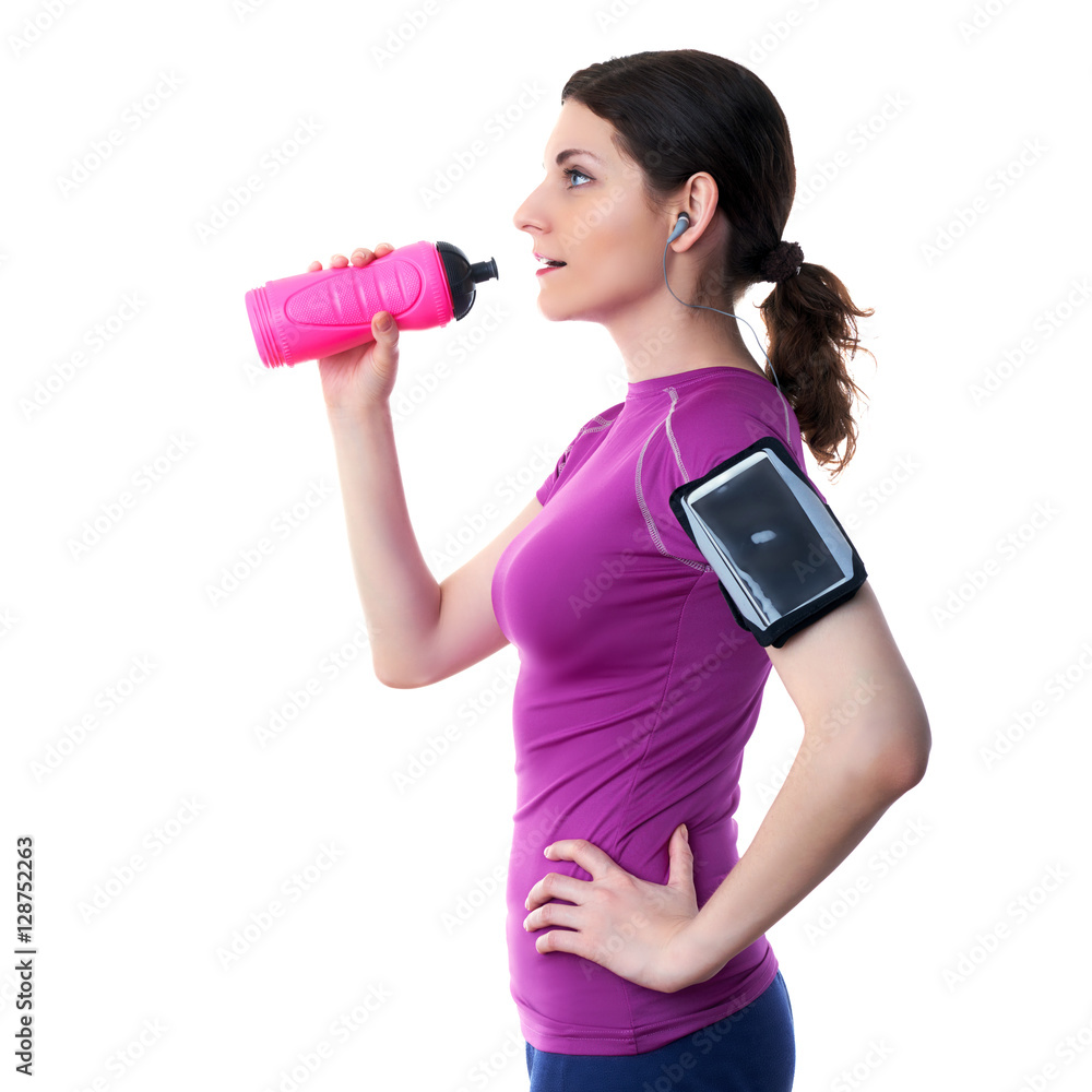 Smiling sporty woman in violet T-short over white isolated background Smiling sporty woman in violet T-short over white isolated background