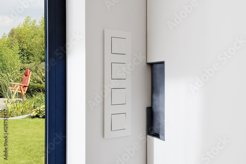 Light Switch near a sliding door in a modern apartment photo