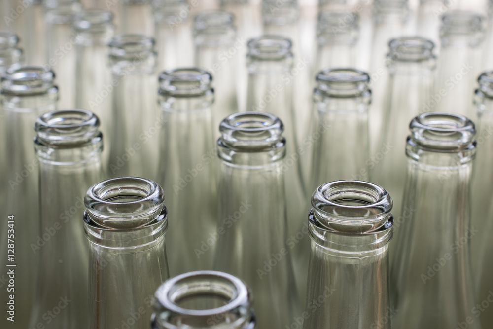 pile of empty transparent glass bottles pile of empty transparent glass bottles