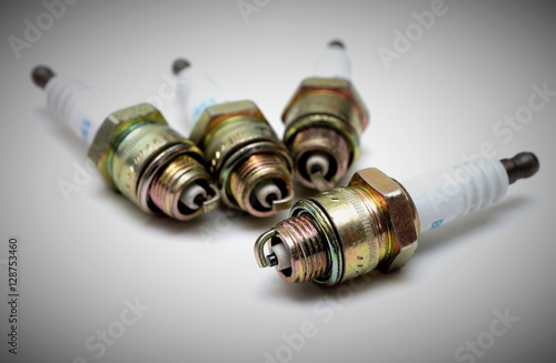 
Several new spark plugs on white background
