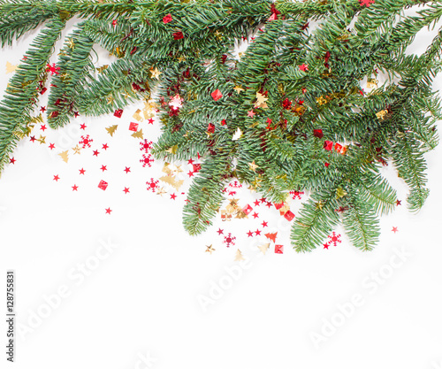 Christmas or New Year background: fur-tree, branches, gifts, decoration on a white background
