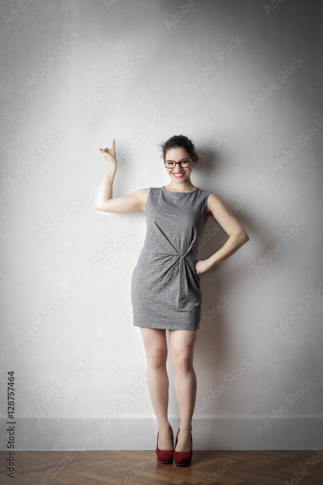 Elegant woman indicating upwards