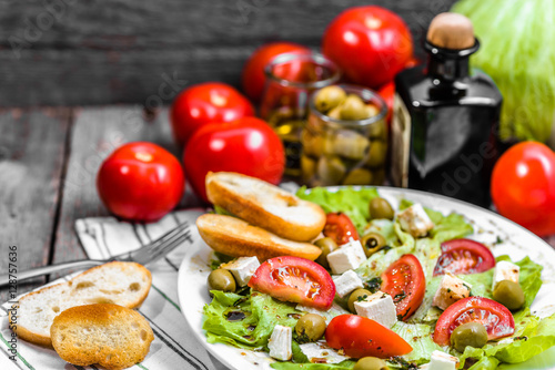 Homemade salad, vegetable greek salads with toasted bread