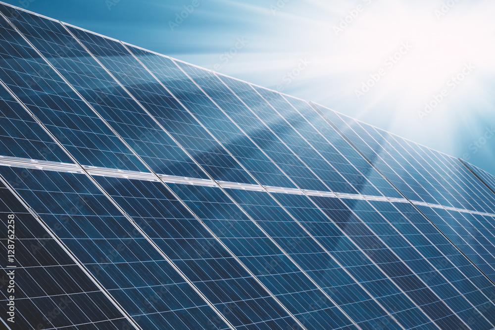 Solar power plant panels with sun rays and blue sky Solar power plant panels with sun rays and blue sky