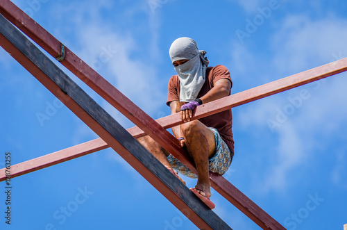 Construction workers working on high risk