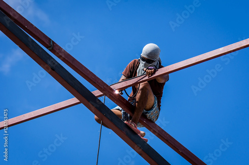 Construction workers working on high risk