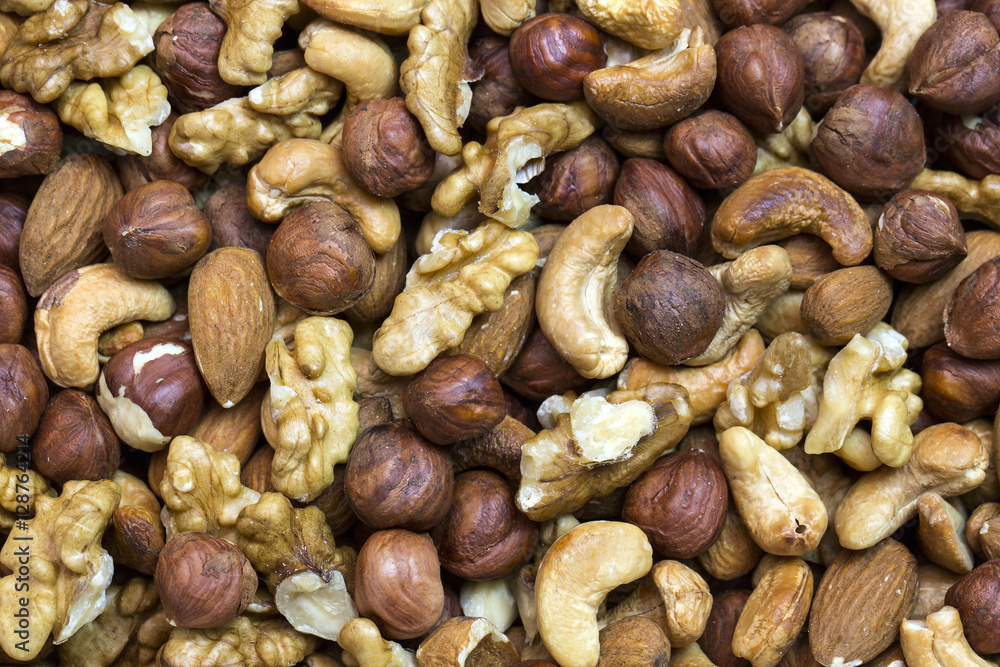 Background mix of nuts and raisins shot close-up