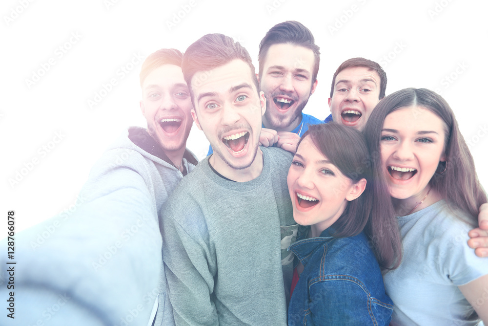 Group of happy young teenager students taking selfie photo isolated on white background Group of happy young teenager students taking selfie photo isolated on white background