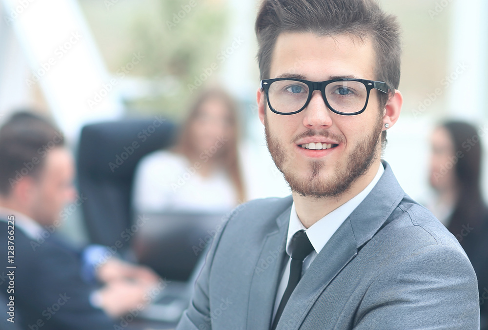 Portrait of an handsome businessman in front of his team Portrait of an handsome businessman in front of his team