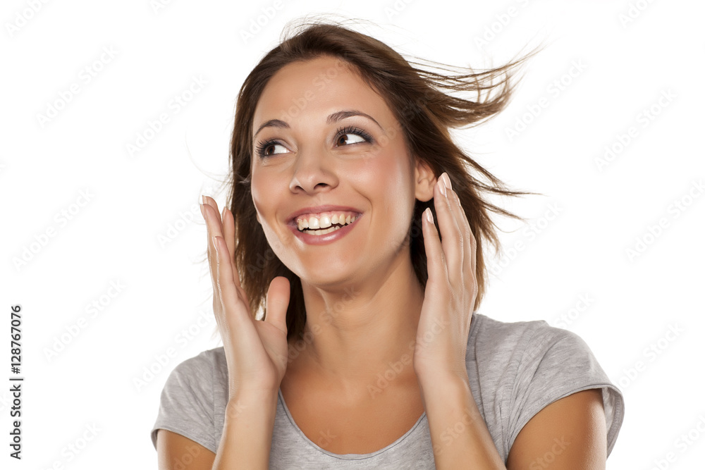 happy young woman posing with wind in her hair happy young woman posing with wind in her hair