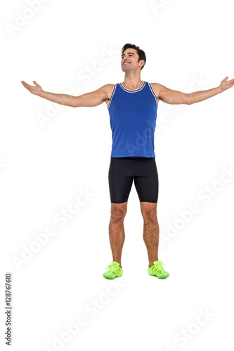 Athlete standing with arms outstretched