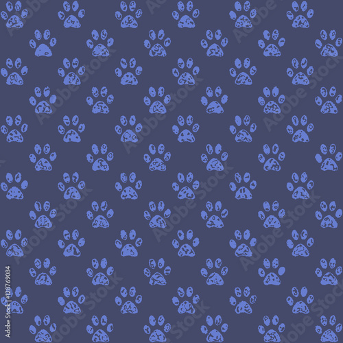 Muddy looking paw prints in middle blue against darker blue background, a seamless background pattern