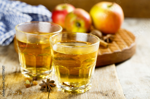 Hot cider with spices in glasses